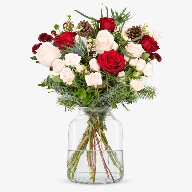 The Noel Christmas bouquet with red roses, cream roses, spruce and pine cones