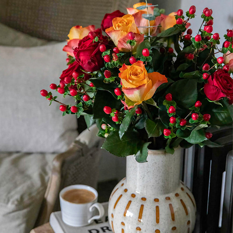 Roses, Hypericum and Eucalyptus with Candle