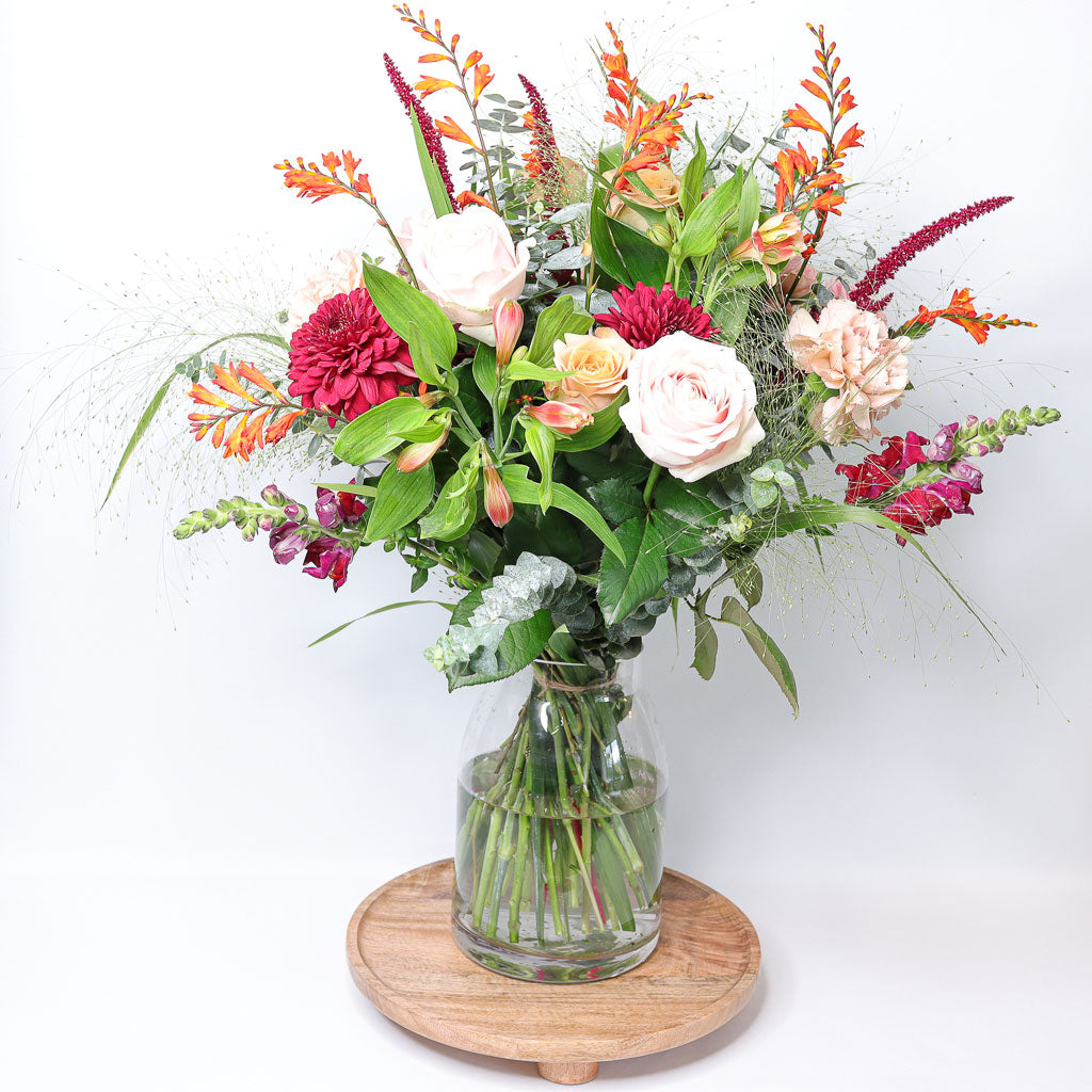 Festive Roses, Amaranthus, Carnations, Alstroemeria and Chrysanthemums.