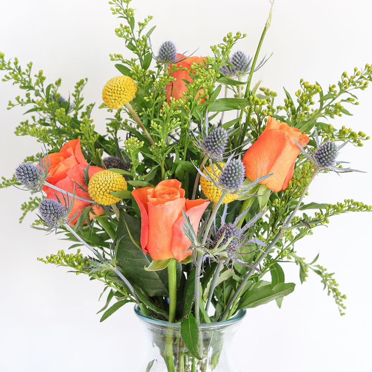 Orange Roses, Craspedia, Solidago and Eryngium