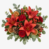 Overhead view of red lilies in The Mulberry hand-tied festive bouquet