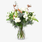 The Snowdrop Bouquet: hand-tied white roses, snapdragons and alstroemeria with eucalyptus, cotton pods and cinnamon sticks